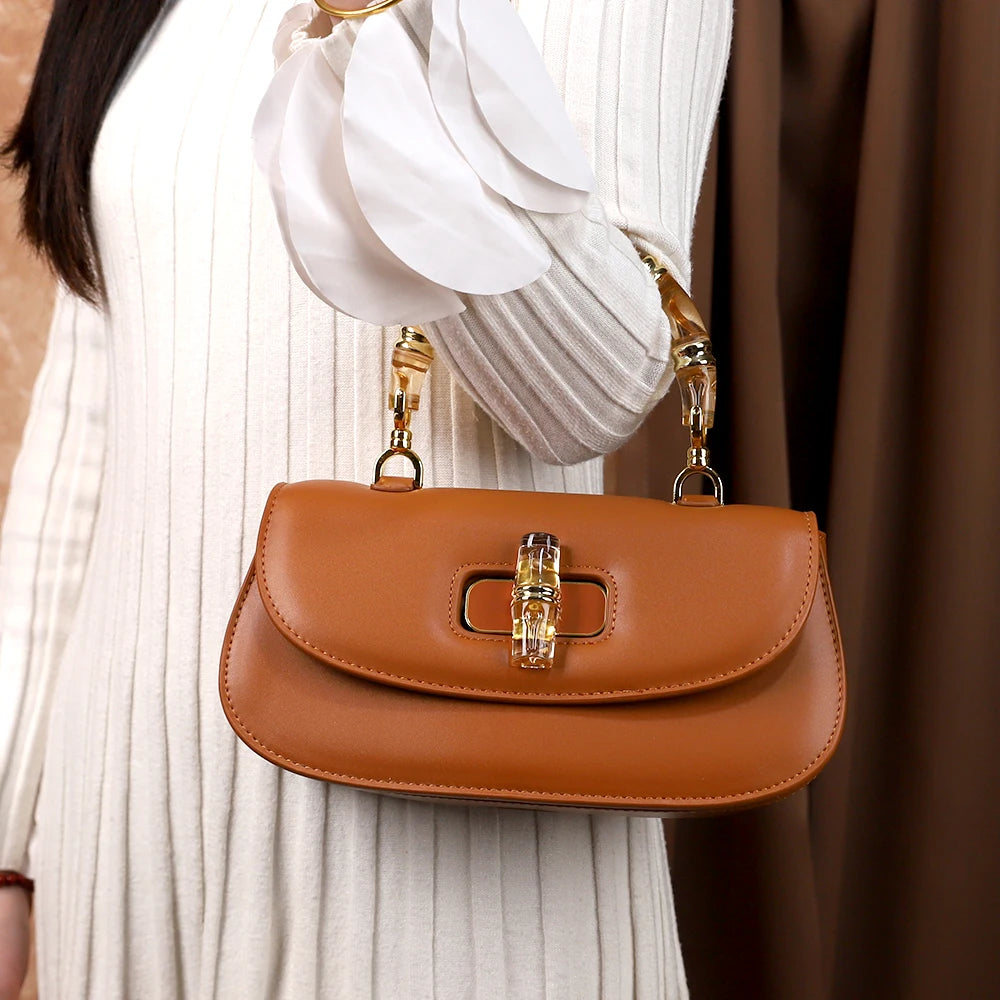 The 2025 new bamboo joint hand-held saddle bag is a versatile and high-end small single-shoulder crossbody bag for women